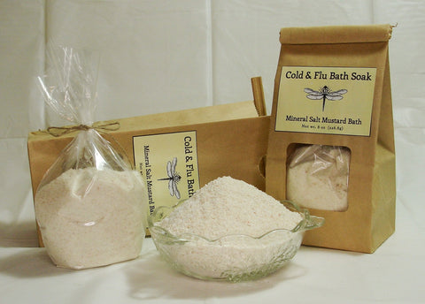 Cold & flu bath soak products in kraft paper packaging with mineral salt and mustard bath ingredients.