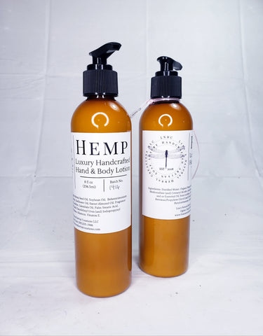 Two amber-colored bottles of hemp-based hand and body lotion with pump dispensers.